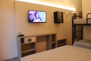 Ένα ή περισσότερα κρεβάτια σε δωμάτιο στο Hotel Roxy