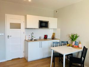 Köök või kööginurk majutusasutuses Nettuno Aparts - Manufaktura