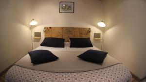 Letto o letti in una camera di Le Clos du Barry