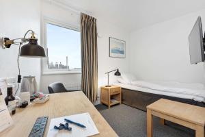 TV o dispositivi per l'intrattenimento presso Best Western Hotel Corallen