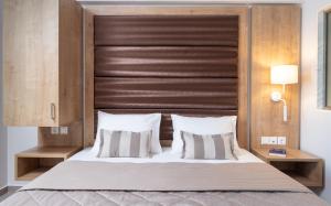 Posteľ alebo postele v izbe v ubytovaní Sarti Premium Suites