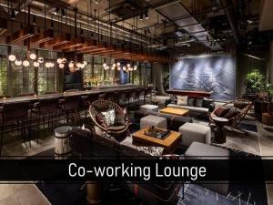 a lobby with couches and a bar in a building at THE LIVELY AZABUJUBAN TOKYO / Vacation STAY 77702 in Tokyo