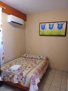 Cama o camas de una habitación en Hotel y Bungalows Olivares