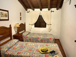 Posteľ alebo postele v izbe v ubytovaní Vivelorural casa en pueblo de Zahara de la Sierra