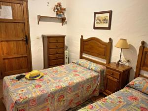 Posteľ alebo postele v izbe v ubytovaní Vivelorural casa en pueblo de Zahara de la Sierra