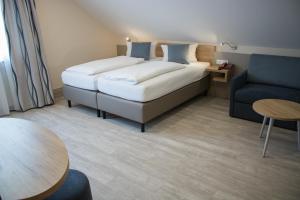 Postel nebo postele na pokoji v ubytování Hotel Rosenbusch + 37 fotografií