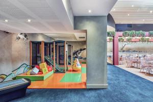 a childrens play area with tables and chairs at Ibis Styles The Entrance in The Entrance