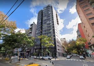 a large tall building on a city street at Departamento Las Cañitas in Buenos Aires