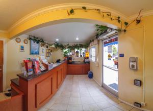 a restaurant with an arch over a food counter at Inn at Golden Gate in San Francisco