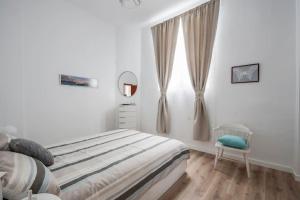 Cosy flat in the heart of Cadizにあるベッド