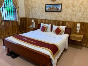 Giường trong phòng chung tại Hiep Thanh Resort