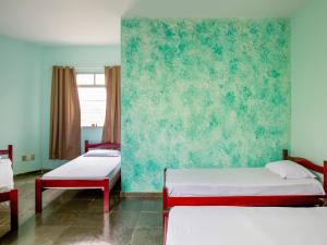 Ένα ή περισσότερα κρεβάτια σε δωμάτιο στο Hotel Lm