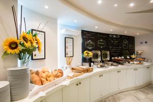 a bakery with a counter with bread and pastries at Golden Star City Resort in Perea