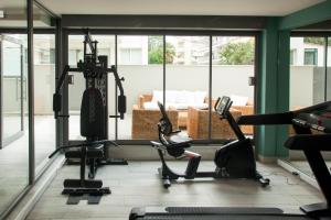 a room with a gym with a couch in the background at Golden Star City Resort in Perea