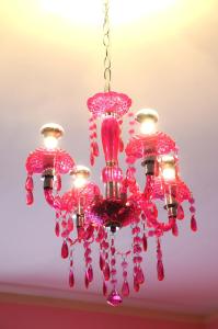 a pink chandelier hanging from a ceiling at Hotel Serenella in Turin