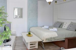 Posteľ alebo postele v izbe v ubytovaní Apartamento Murillo