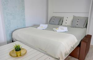 Posteľ alebo postele v izbe v ubytovaní Apartamento Murillo