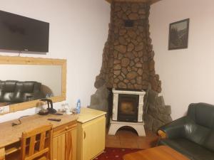 Televízia a/alebo spoločenská miestnosť v ubytovaní Wisła Mountain SPA