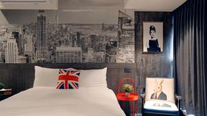 Postel nebo postele na pokoji v ubytování K Hotel - Yizhong