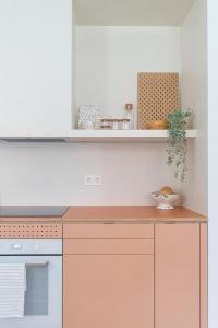 a kitchen with a counter top and a stove at Bilbao Park by Aston Rentals in Bilbao