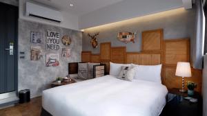 Postel nebo postele na pokoji v ubytování K Hotel - Yizhong