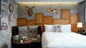 Postel nebo postele na pokoji v ubytování K Hotel - Yizhong