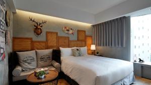 Postel nebo postele na pokoji v ubytování K Hotel - Yizhong