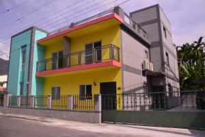 a colorful building with a fence in front of it at 鳳林好日子 in Fenglin