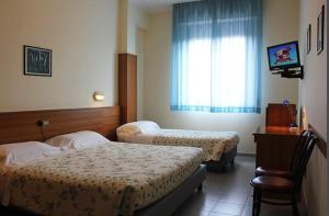 Posteľ alebo postele v izbe v ubytovaní Hotel il Focolare