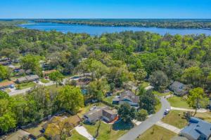 an aerial view of a home with a lake at Blue Heron in Jacksonville
