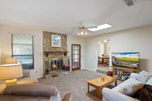 a living room with a couch and a fireplace at Blue Heron in Jacksonville