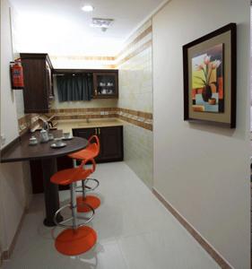 A kitchen or kitchenette at Lavande Suites