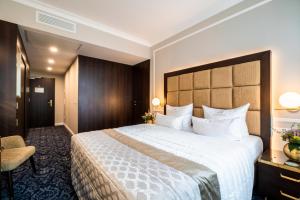 Postel nebo postele na pokoji v ubytování Hotel Suitess