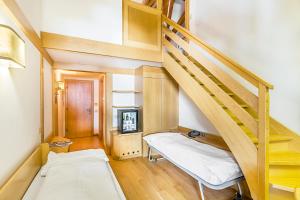 Voodi või voodid majutusasutuse Hotel Cristiania toas