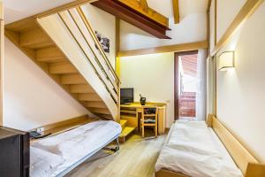 Voodi või voodid majutusasutuse Hotel Cristiania toas