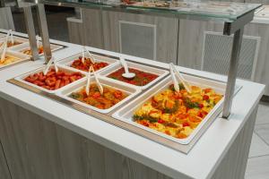 a kitchen counter filled with lots of different types of food at AMAKS Golden Ring in Vladimir