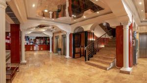 
a large room with a stairway leading to a stairwell at Magic Cristal Park in Benidorm
