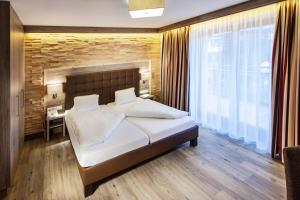 Voodi või voodid majutusasutuse Hotel am Reiterkogel toas