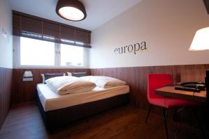 Postel nebo postele na pokoji v ubytování Hotel Europa Life