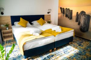 Postel nebo postele na pokoji v ubytování Plaża Resort Łeba