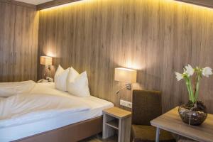 Ένα ή περισσότερα κρεβάτια σε δωμάτιο στο Hotel am Reiterkogel