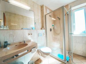 Koupelna v ubytování Hotel Schwertfirm
