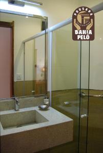 a bathroom with a sink and a sign for a bariba pub at Pousada Bahia Pelô in Salvador