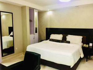 Ένα ή περισσότερα κρεβάτια σε δωμάτιο στο BW Starfire Hotel