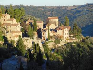 an aerial view of a village on a mountain at Larocchettina in Castiglione dʼOrcia