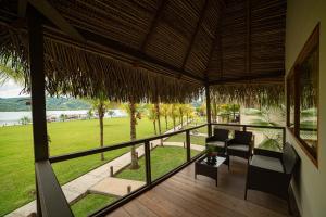 a room with a balcony with a view of a field at El Sauce Resort - Hotel Asociado Casa Andina in Sauce