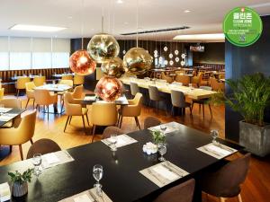 a restaurant with tables and chairs and balls at Hotel PJ Myeongdong in Seoul