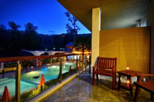 a resort patio with a swimming pool at night at Chaweng Noi Pool Villa in Chaweng Noi Beach
