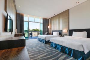 Postel nebo postele na pokoji v ubytování City Suites - Kaohsiung Chenai