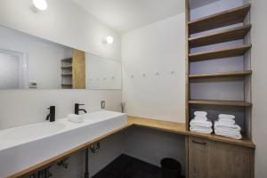 a bathroom with a sink and a mirror at Japan Sessions KANZAKI 01 in Osaka